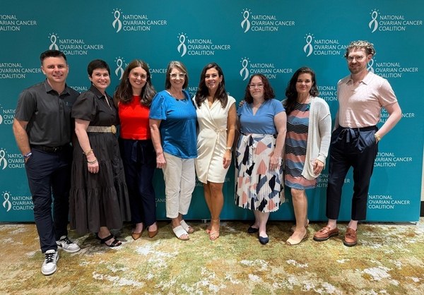 Picture of a group of smiling people, team members of nonprofit NOCC